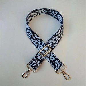 Adjustable black and white leopard print bag strap with golden metal swivel hooks