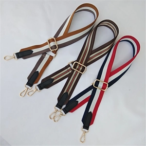 Detailed macro view of three adjustable canvas replacement straps with gold metal clasps