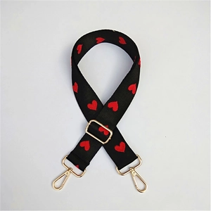 Adjustable black replacement purse strap with red heart embroidery and gold metal hooks