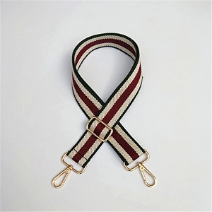 Adjustable striped guitar-style shoulder strap with red white and black pattern and gold hooks