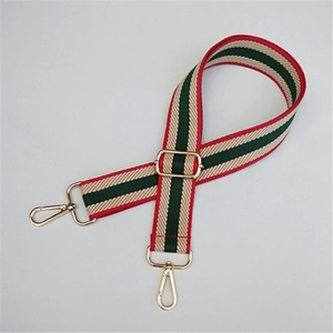 Adjustable wide shoulder strap with red and green stripes and gold metal buckles