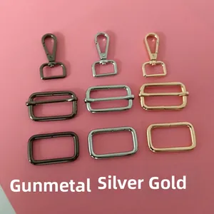 Detail of swivel carabiner hooks and metal buckles in gunmetal, silver and gold finishes