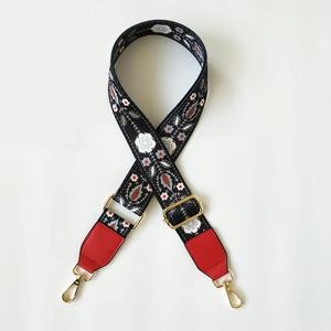 Close-up of ethnic style jacquard embroidery bag strap with golden metal hardware