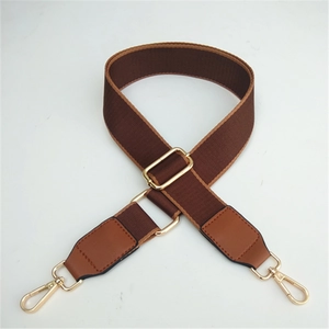 Adjustable brown nylon shoulder strap for crossbody bags with gold metal hardware hooks