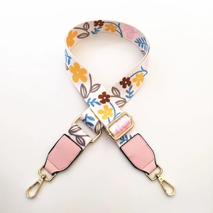 Adjustable bohemian floral handbag strap with pink faux leather ends and gold metal clips