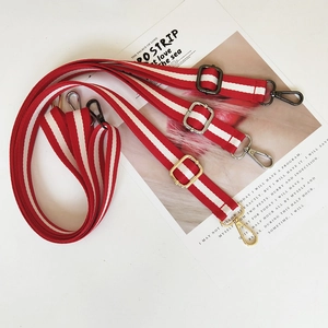 Adjustable red and white striped canvas strap with gold, silver, and black metal hooks