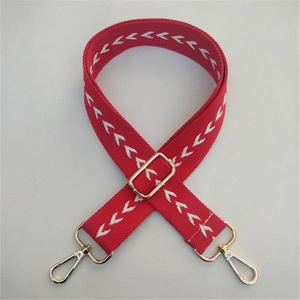 Adjustable red ethnic style cotton handbag strap with white arrow pattern and gold hardware