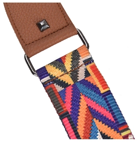 Close-up of leather strap connector with metal rivet and colorful geometric weave pattern