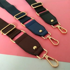 Adjustable nylon and PU leather straps in black, blue, and brown with gold hardware
