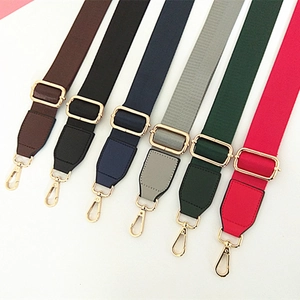 Adjustable nylon webbed shoulder straps in multiple colors with gold metal hardware