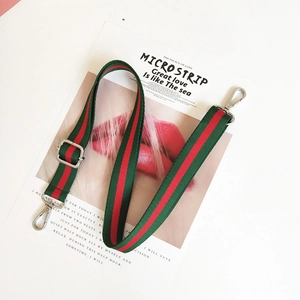 Adjustable green and red striped canvas strap with silver metal hooks and sliders