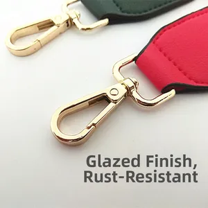 Detail of rust-proof golden lobster clasp with glazing process on nylon bag straps