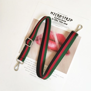 Adjustable green and red striped canvas shoulder strap with silver metal hooks