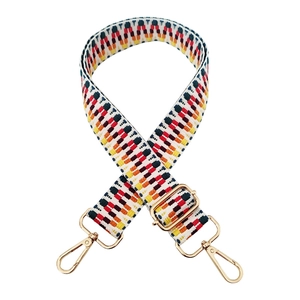 Close-up of colorful woven geometric strap with premium gold metal buckles and lobster clasps