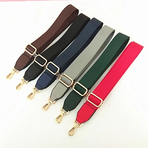 Detailed view of adjustable nylon bag straps in six colors with gold metal buckles