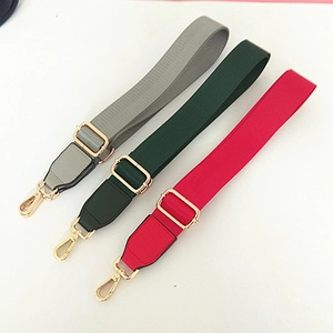 Adjustable nylon wide shoulder straps for bags in grey, green and red with gold metal hooks