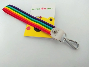 Rainbow striped woven wristlet strap with white leather trim and silver metal clasp