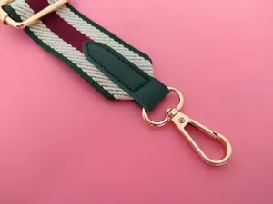 Adjustable wide replacement shoulder strap with green leather and gold hardware