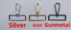 Detailed view of metal swivel lobster clasps in silver, gold, and gunmetal finishes