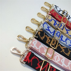 Adjustable embroidered bag straps with gold metal clips in various colorful patterns