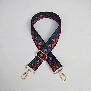 Detailed view of adjustable ethnic strap with colorful geometric diamond patterns and gold hooks