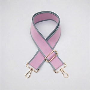 Detail of pink and grey striped wide guitar strap with golden metal lobster clasps