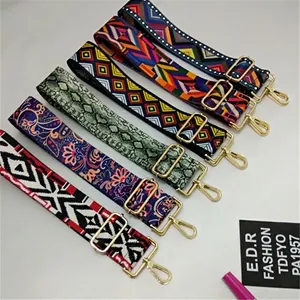 Adjustable woven handbag straps with colorful geometric patterns and gold metal buckles