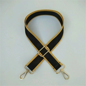 Adjustable black nylon shoulder strap with gold metal buckles and yellow side borders