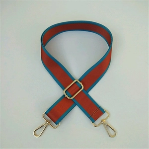 Adjustable wide replacement bag strap with orange and blue contrast weave and gold hardware