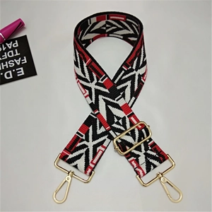 Detailed view of adjustable wide strap with red black white geometric woven pattern