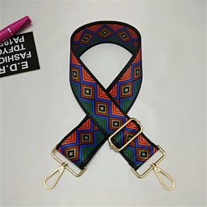 Macro shot of colorful geometric woven bag strap with adjustable gold alloy hardware buckles
