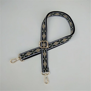 Adjustable ethnic style embroidered bag strap with golden floral patterns and lobster clasps