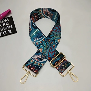 Detail of bohemian mandala pattern wide strap with adjustable light gold metal buckles