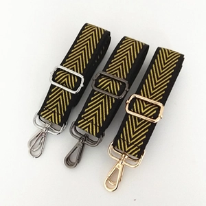 Detail view of woven nylon shoulder straps with adjustable metal buckles in various finishes