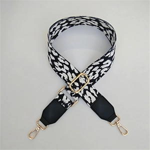 Adjustable black and white animal print canvas shoulder strap with gold metal buckles