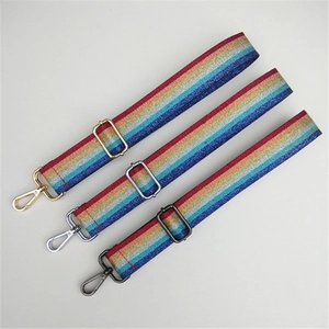 Detail of glitter rainbow replacement bag straps with gold, silver, and black metal hooks