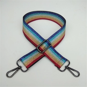Detailed view of rainbow sequin bag strap with gunmetal swivel hooks and metal buckle