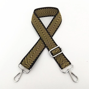 Detail of adjustable nylon shoulder strap with yellow chevron pattern and silver swivel hooks