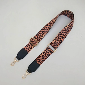 Adjustable leopard print wide shoulder strap with black leather ends and gold metal hooks