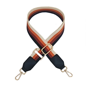 Adjustable colorful striped fabric bag strap with black leather ends and gold metal hooks
