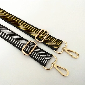 Adjustable nylon shoulder straps with chevron patterns and gold metal swivel hooks