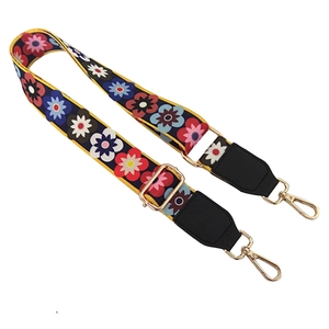Adjustable wide shoulder strap with vibrant floral pattern and gold metal hooks