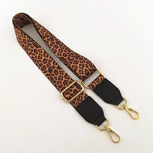 Adjustable leopard print bag strap with gold metal hooks and black leather reinforced ends