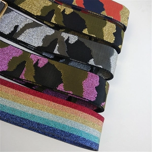 Detail of 5cm wide camouflage shoulder straps with metallic glitter and gold hardware