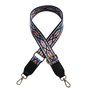 Ethnic wide woven floral purse strap with adjustable gold buckle and black leather ends