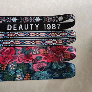 Detailed flat lay of adjustable ethnic style wide straps with colorful floral patterns