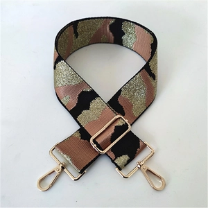 Close-up of 5cm wide camouflage shoulder strap with golden glitter and metal swivel hooks
