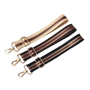 Adjustable woven nylon shoulder straps with striped pattern and gold metal hooks