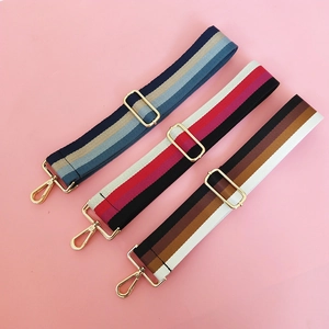 Detail of adjustable thick striped cotton bag straps with gold metal hooks in three colors