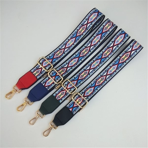 Set of four colorful ethnic style woven bag straps with gold metal hardware on white background